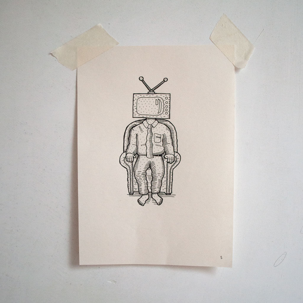 Man in chair wearing a TV